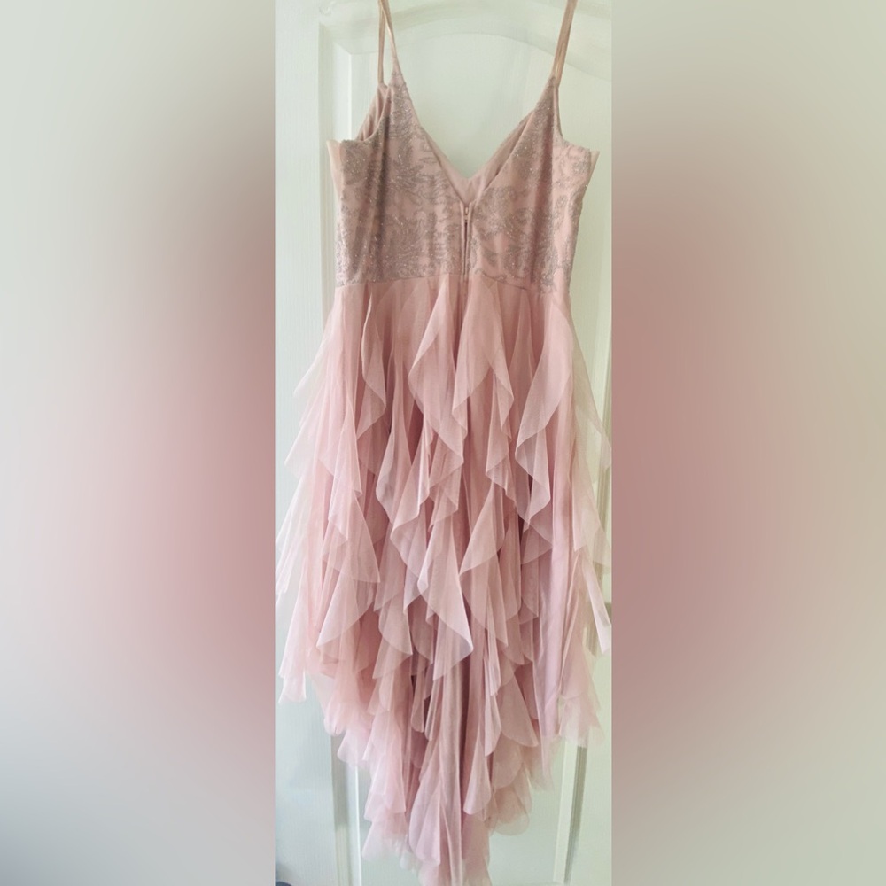 Stunning and super fun, hi-low, ruffle dress with rhinestone trim. - Picture 5 of 5